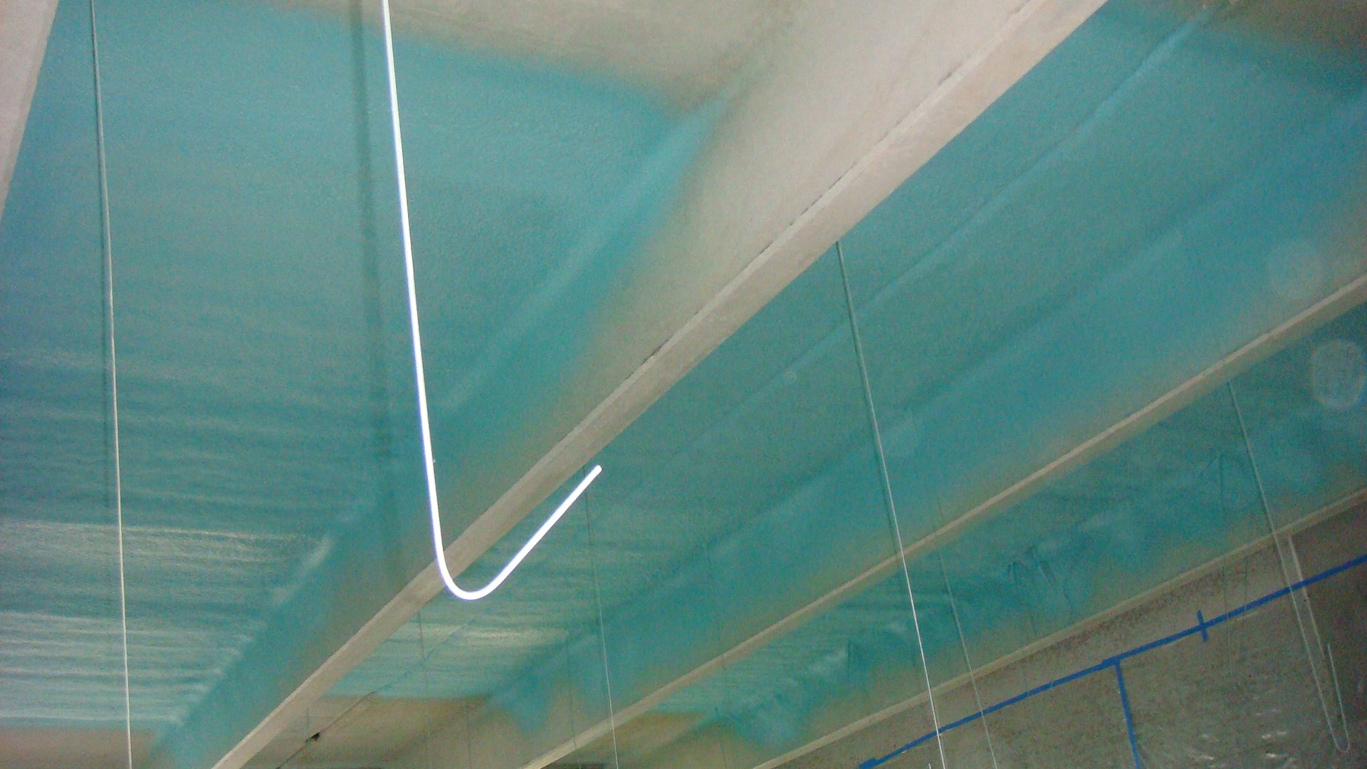 Applicator spraying seamless polyurea coating