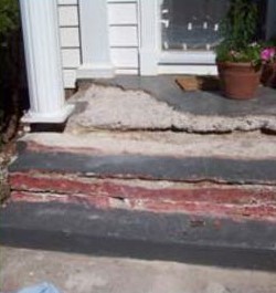 Below-grade concrete wall prepared for polyurea waterproofing